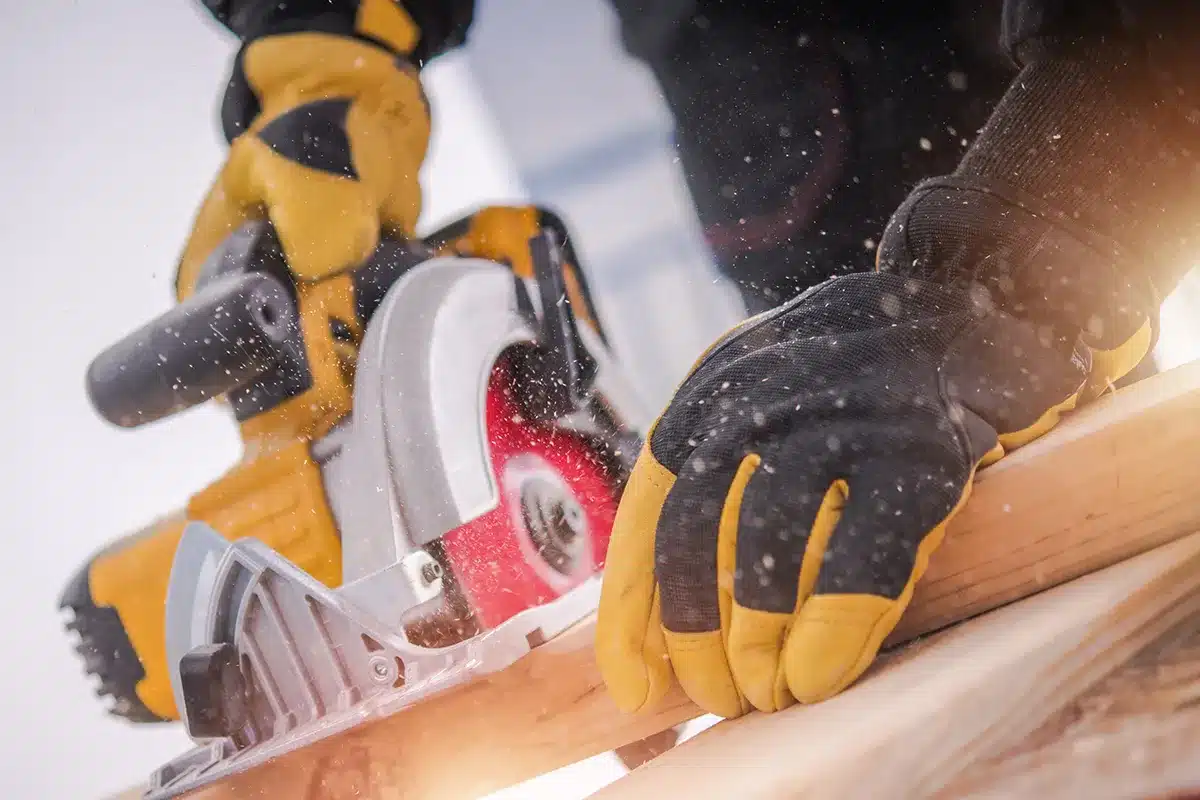 close up of reciprocating saw cutting dimensional lumber