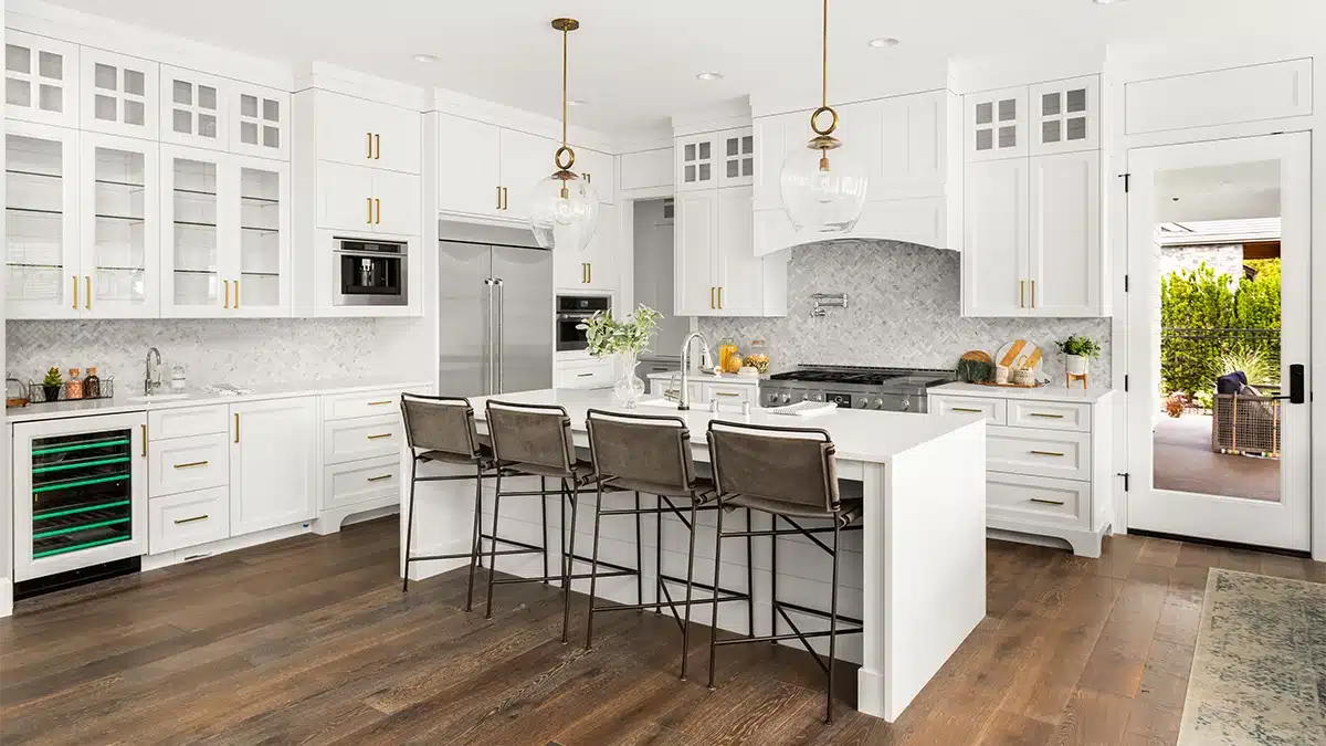 Custom white kitchen with dark wood floors