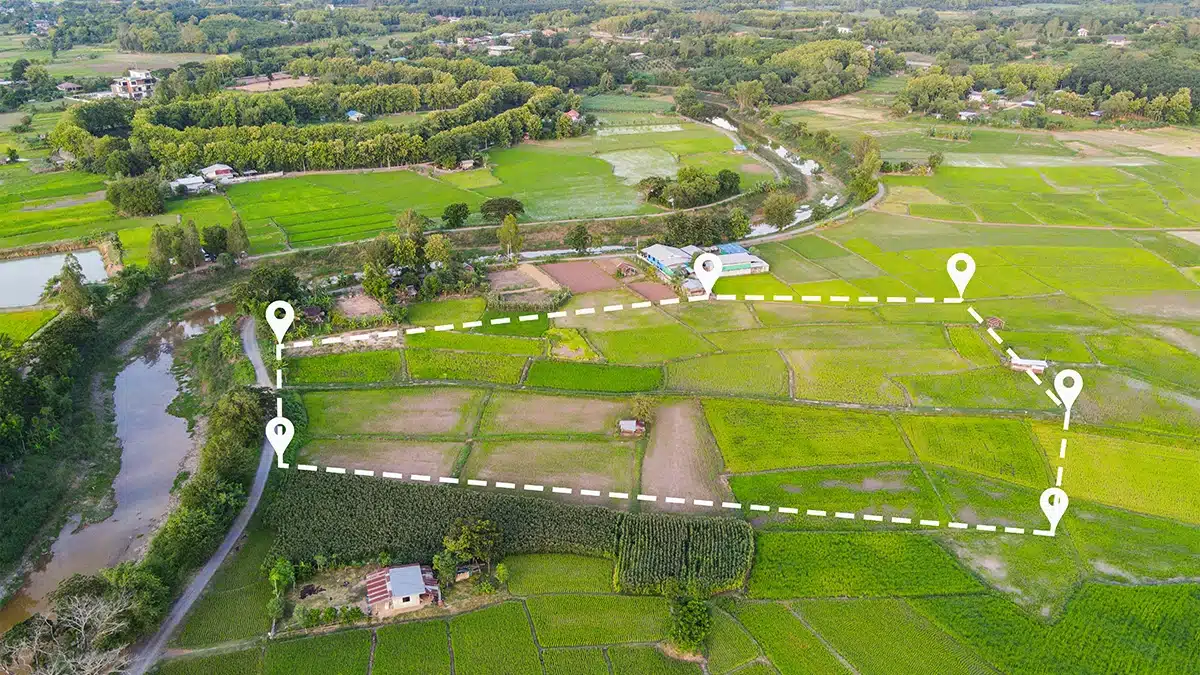 Land near river with white property line overlay